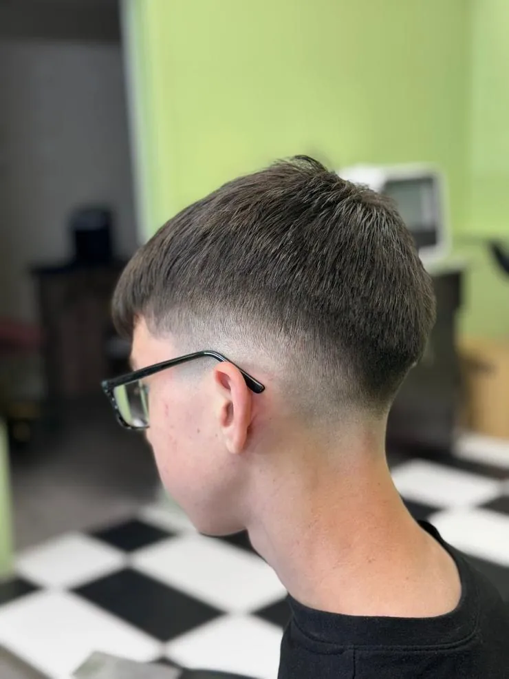 Back and side view of a clean taper fade haircut
